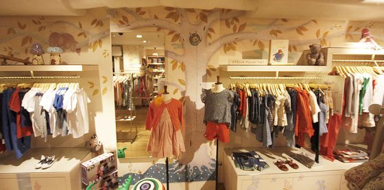 Children's clothes. Liberty London. Tree magic forest mural artwork. Richard Johnson illustrator.